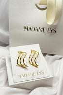 Boucles d’oreilles dorées waves élégantes